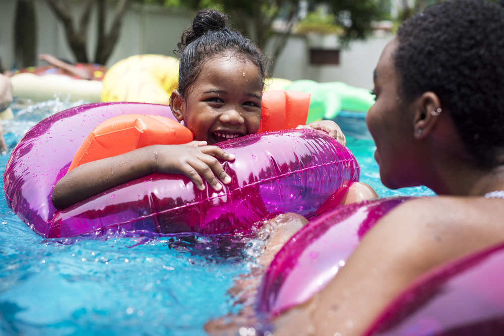 girl and other swimming in a pool